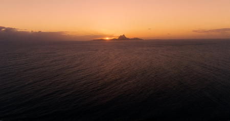 sunset on an islet in French Polynesiaの写真素材