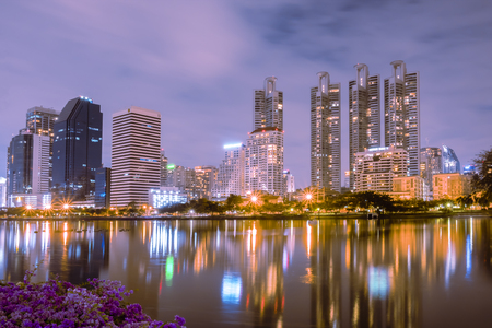 Bangkok, Thailand - December 5, 2017 : benjakiti park Landscape building at night reflects the beautiful pondのeditorial素材