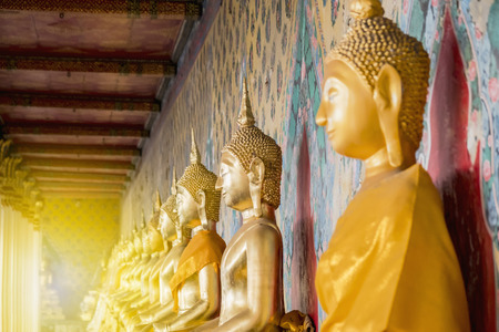 The Buddha at Wat Arun Bangkok Thailand to Buddhist or tourists pay homage.の写真素材