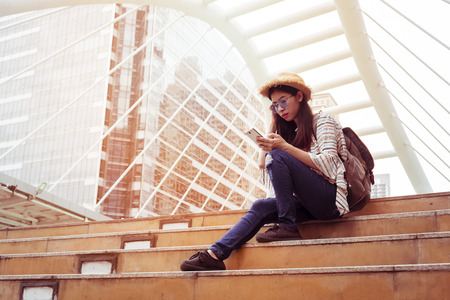 Asian women tourist Playing Smartphone To check out the attractions in Bangkok, Thailand. selfie and Upload photo to social.の写真素材