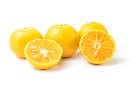 fresh oranges full and half cut Rich in vitamin C isolated on white backgroundの写真素材