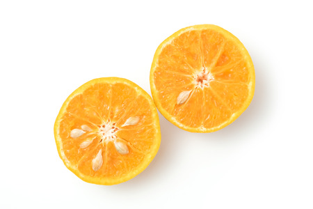 fresh oranges half cut rich in vitamin C isolated top view on white background and clipping pathの写真素材