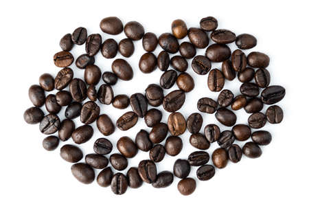 Pile of coffee beans isolated top viwe on white background.の写真素材