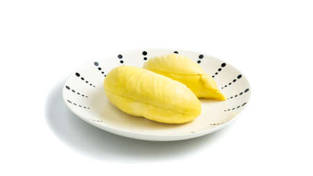 Durian in a plate on a white background and clipping path. Durian is a Thai fruit that is delicious and has a pleasant aroma.の写真素材
