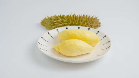 Durian in a plate on a white background and clipping path. Durian is a Thai fruit that is delicious and has a pleasant aroma.の写真素材