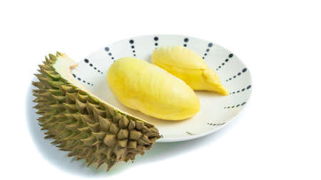 Durian in a plate on a white background and clipping path. Durian is a Thai fruit that is delicious and has a pleasant aroma.の写真素材
