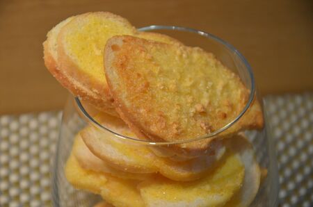 Shot on baked garlic bread の写真素材