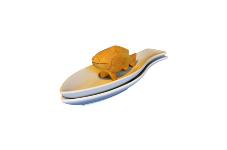 Wood fish on a white dishの写真素材