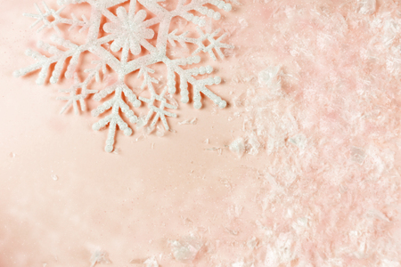 Pink Christmas holidays background with snowflake with copy space.の写真素材