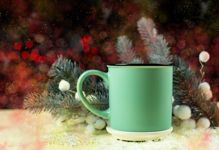 Christmas mint mug with copy space over Christmas tree bokeh background.の写真素材