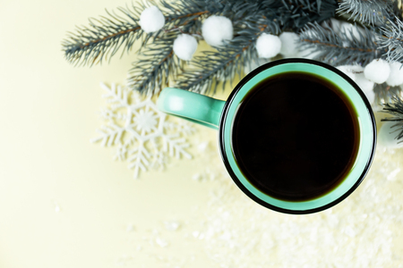 Holiday Christmas mug with copy space over Christmas tree background.の写真素材