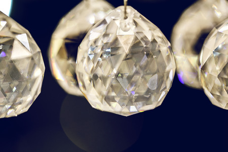 Close up on crystal glass glittering chandelierの写真素材