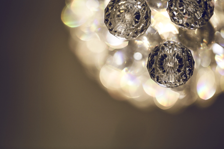 Close up on crystal glass glittering chandelierの写真素材