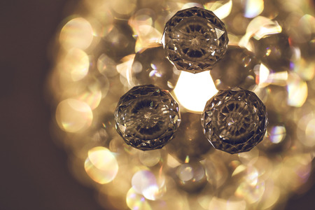 Close up on crystal glass glittering chandelierの写真素材
