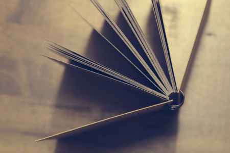 The workplace, notebook on wooden table background, vintage designの写真素材