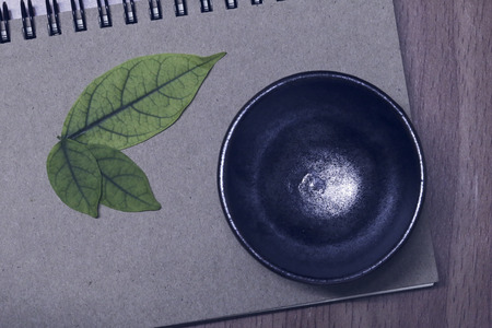 cup of tea on notebook.Top view with copy space