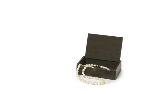 Wooden box with pearl necklace Isolated,against a white background. picture used designの写真素材
