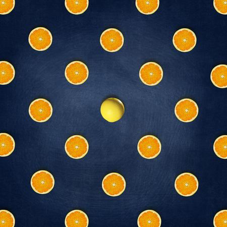 Abstract fruit : Outstanding Orange middle around half oranges on blackboard background. top view