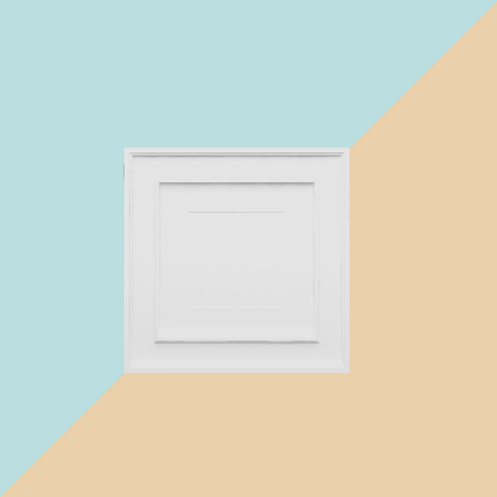 White picture frame on light blue and orange pastel  background. minimal concept idea.の写真素材