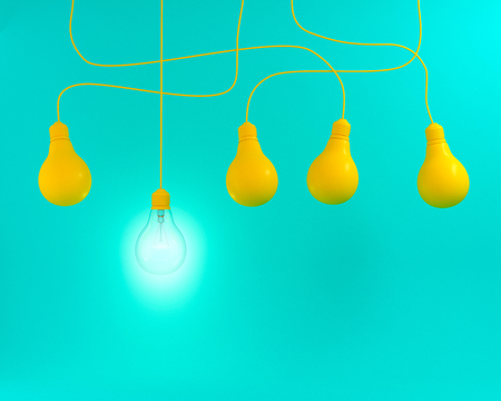 Hanging yellow light bulbs with glowing one different idea on green pastel background ,  flat lay , Minimal concept idea の写真素材