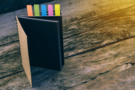Diary with colored tabs. Five colorful bookmarks with notebook , closeup of colour tabs for...