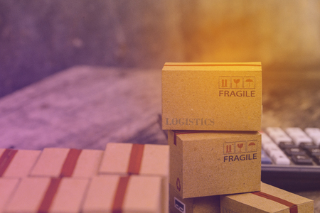 business concept: Pile of light brown small cardboard boxes. Concept of Shipping that can be done easily or purchase goods or services remotely. just using an online internet. transportationの写真素材