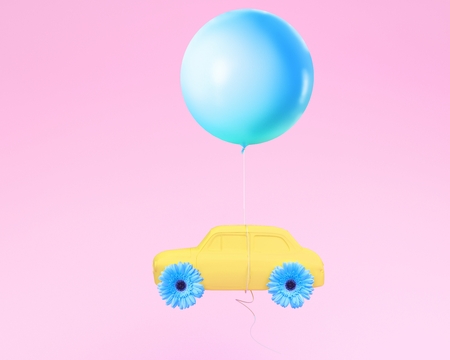 Flower layout wheel and car yellow with blue balloon floating on pink pastel background. minimal idea creative concept.の写真素材