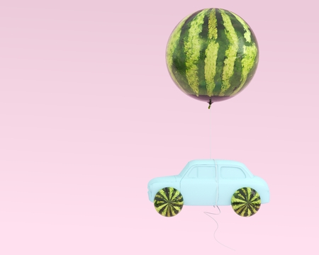 Watermelon layout wheel and car blue with watermelon balloon floating on pastel pink background. minimal idea food and fruit summer concept. の写真素材