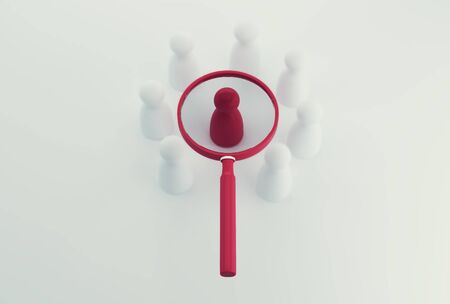 Magnifying glass with red people model outstanding out from the crowd.の写真素材