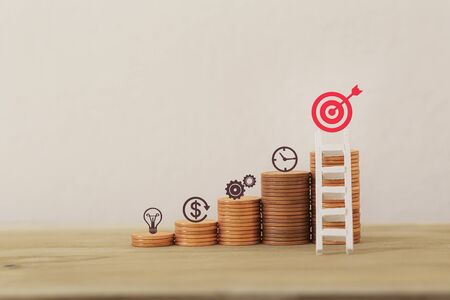 Financial management/goals asset investment concept: Arrange business plan icon on rows of rising coins, Demonstrating excellent performance through arranging a portfolio for maximum profit.の写真素材
