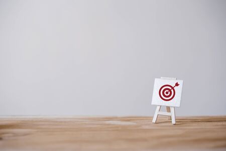 Sign stand with an arrow in the target.Tactics of advertising targeting. advertise campaigns. Goal achievement and Purposefulness.の写真素材