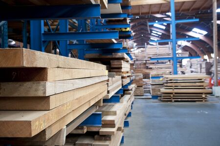 packed warehouse with wood ready for constructionの写真素材