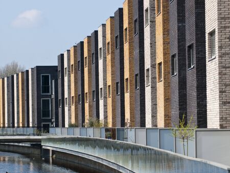 A row of new brick houses in contrasting colors.の写真素材