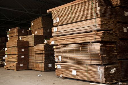 Tacks of a hardwood in lumber warehouse ready for transportation.の写真素材