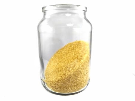 Jar of brown sugar shot on a white backgroundの写真素材