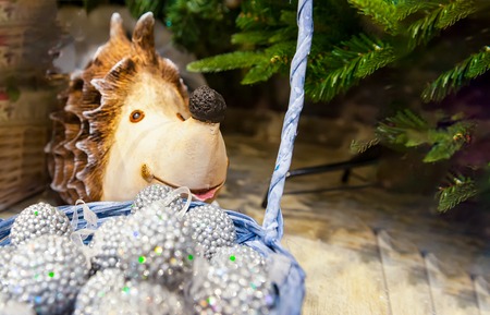 Many colored Christmas balls in a basket colorful And under the Christmas tree hedgehog Christmas xmas Backgroundの写真素材