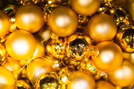 Many Christmas golden balls in basket and star in colorful xmas Background