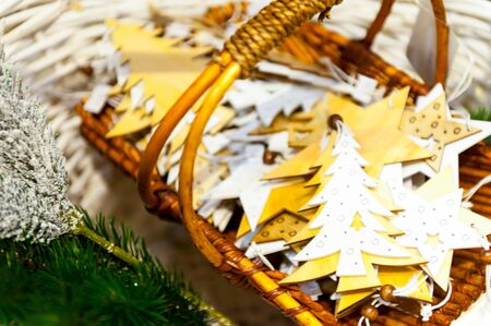 Christmas Fir Tree and stars Toys Old wooden in the basket Burning Candles, Boxes, Balls, Pine Cones, Walnuts, Branchesin the background other decorations and garlands.の写真素材
