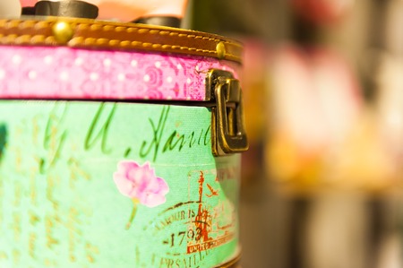 Bag retro bright colored leather trim iron lock closed.