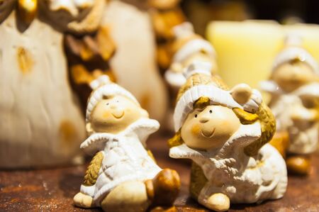 Wooden figure of children in winter clothes Christmas background.の写真素材
