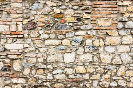 pattern gray color of modern style design decorative uneven cracked real stone wall surface with...