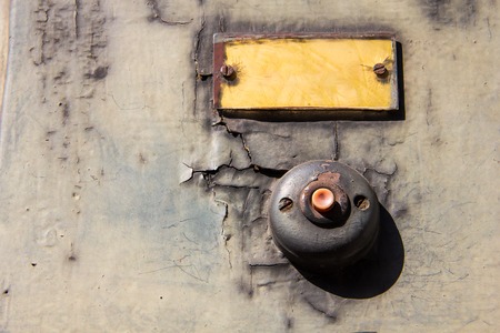 Old vintage door bell button on grunge wall Antique door bellの写真素材