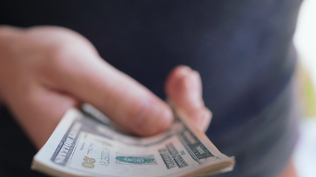 Businessman hands counting many american 20 dollars banknotes 4K close up slow mo