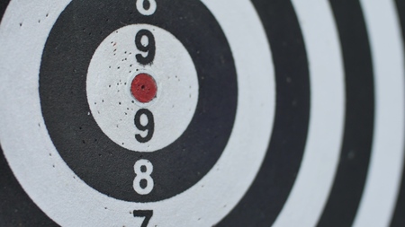 hitting bulls eye, single shot bulls-eye. Concept of successful business ideas hitting the exact...