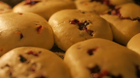 Baking muffins with berry filling with dough Selective focus shot of muffins baking, time-lapse