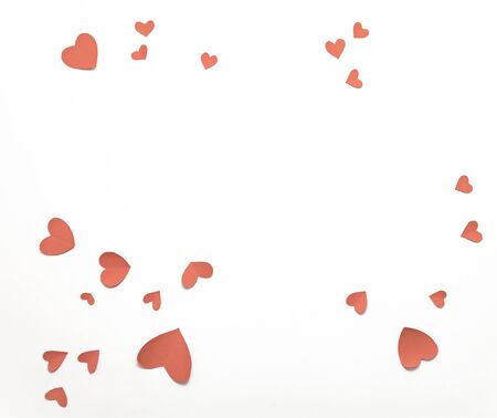 Top view valentines day decorations flat lay. Pink hearts on white background. Happy St. Valentine's Day banner template, white paper frame, copy space. Holiday concept mock up, greeting card.の写真素材