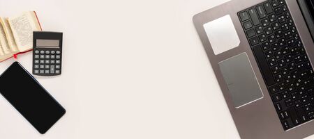 Stay at home white background flatlay. Home office computer laptop smartphone dictionary top view template long banner. Copy space backdrop mock up design Distance education creative work concept.の写真素材