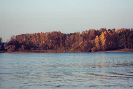 Beautiful lake landscape, and sunset. Blue waves and horizon line on water. Beautiful background...