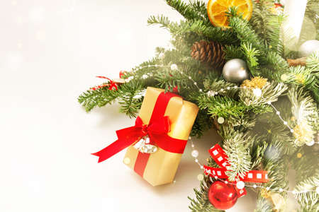 Christmas table decoration banner. Green fir branches candle gift boxes blue balls lights isolated white background. Minimalist home new year decor old style. Xmas concept copy space mock up bannerの写真素材