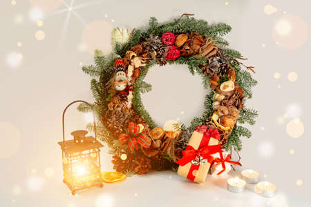 Christmas table decoration banner. Green fir branches candle gift boxes blue balls lights isolated white background. Minimalist home new year decor old style. Xmas concept copy space mock up bannerの写真素材